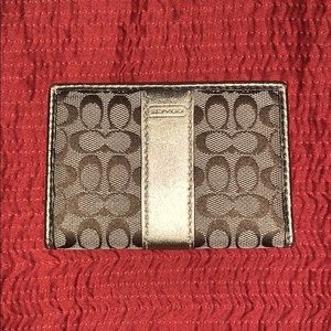 Coach gold card case. Never used.
